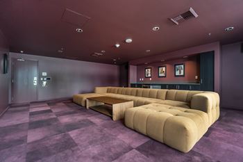 Screening room with modular seating and purple carpet